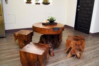a table made out of tree stump furniture at Taitung Venice B&amp;B in Taitung City