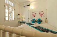 Een bed of bedden in een kamer bij Fort Heaven - Galle Fort