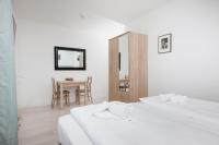 Łóżko lub łóżka w pokoju w obiekcie Apartamenty Aquamarina by Noclegi Renters