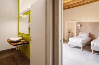 Posteľ alebo postele v izbe v ubytovaní B&B Dimora De Roteris