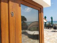 a sliding glass door with a view of the ocean at Vila pe plaja nr 9 in Saturn
