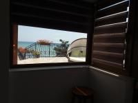 a window in a room with a view of the ocean at Vila pe plaja nr 9 in Saturn