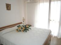 A bed or beds in a room at Andrea