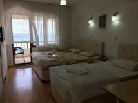 Postel nebo postele na pokoji v ubytování KOÇAN OTEL Hatice Karakoçan
