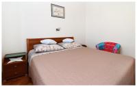 Postel nebo postele na pokoji v ubytování Apartmani Petra