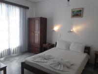 Postel nebo postele na pokoji v ubytování Bizas Rooms & Studios