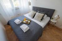 Postel nebo postele na pokoji v ubytování Apartment Lita Center