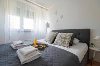 Postel nebo postele na pokoji v ubytování Apartment Lita Center