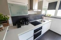 Kuchyň nebo kuchyňský kout v ubytování Apartment Lita Center
