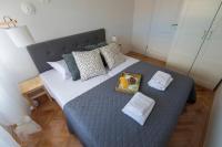 Postel nebo postele na pokoji v ubytování Apartment Lita Center