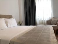 Postel nebo postele na pokoji v ubytování Joy Suites
