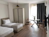 Postel nebo postele na pokoji v ubytování Joy Suites