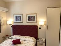 A bed or beds in a room at B&B Primerano SP73