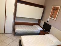 A bed or beds in a room at B&B Primerano SP73