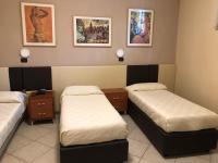 A bed or beds in a room at B&B Primerano SP73