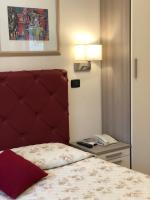 A bed or beds in a room at B&B Primerano SP73