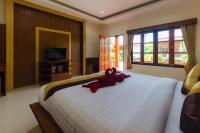 Sleep In Lanta Resortにあるテレビまたはエンターテインメントセンター