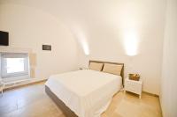 Posteľ alebo postele v izbe v ubytovaní Scirocco Apartment with terrace by Wonderful Italy