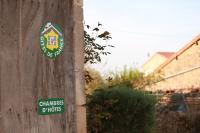 a sticker on the side of a wooden pole at Domaine de la Saule in Jalogny