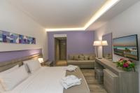 A bed or beds in a room at Akti Imperial Deluxe Resort & Spa Dolce by Wyndham