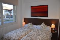 A bed or beds in a room at Pensión Grosen