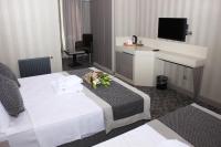 A television and/or entertainment centre at Anka Premium Hotel