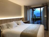 Postel nebo postele na pokoji v ubytování Villa de Plan Apartments&Suites