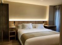Postel nebo postele na pokoji v ubytování Villa de Plan Apartments&Suites
