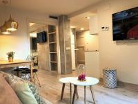 TV a/nebo společenská místnost v ubytování Villa de Plan Apartments&Suites