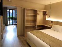Postel nebo postele na pokoji v ubytování Villa de Plan Apartments&Suites