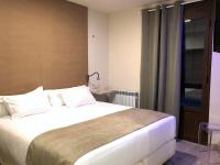 Postel nebo postele na pokoji v ubytování Villa de Plan Apartments&Suites