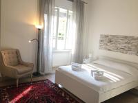 Łóżko lub łóżka w pokoju w obiekcie Miani House