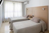 Posteľ alebo postele v izbe v ubytovaní Hotel Alamo