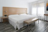 Posteľ alebo postele v izbe v ubytovaní Hotel Alamo