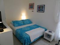 Postel nebo postele na pokoji v ubytování Apartments Kuzmanic