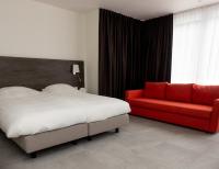 Een bed of bedden in een kamer bij Hotel-Restaurant Het Rechthuis