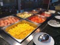 a buffet line with many trays of food at Paraiso del Sol y Paradero in Playa de las Americas