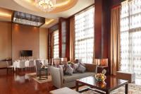 a living room with a couch and a table at Beijing Hotel Minsk in Minsk