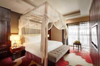 a bedroom with a canopy bed and a window at Beijing Hotel Minsk in Minsk