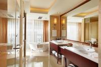 a bathroom with two sinks and a large mirror at Beijing Hotel Minsk in Minsk