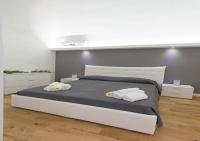 Posteľ alebo postele v izbe v ubytovaní Manganelli Home