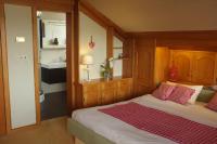 Postel nebo postele na pokoji v ubytování Dreimäderlhaus - Das vegetarische Boutique Hotel