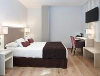 Posteľ alebo postele v izbe v ubytovaní Hotel Maestranza