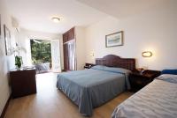 Posteľ alebo postele v izbe v ubytovaní Hotel Antares