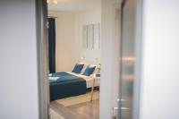 Posteľ alebo postele v izbe v ubytovaní Rába Apartman House