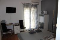 Televízia a/alebo spoločenská miestnosť v ubytovaní Apartments & Rooms Tea
