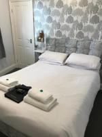 Postel nebo postele na pokoji v ubytování Grosvenor Hotel