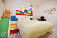 a bedroom with a lego bed and a teddy bear at Relax heart B&amp;B in Dongshan