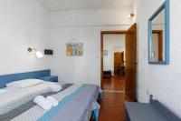 Postel nebo postele na pokoji v ubytování Emmanuel Apartments