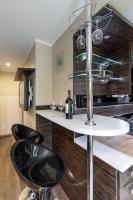 Kuchyň nebo kuchyňský kout v ubytování Apartament Coffee Zakopane